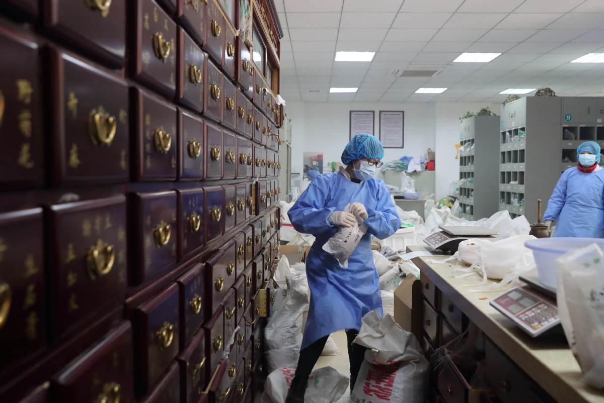 A pharmacist prepares a TCM prescription at the Sixth Hospital of Wuhan Hubei province