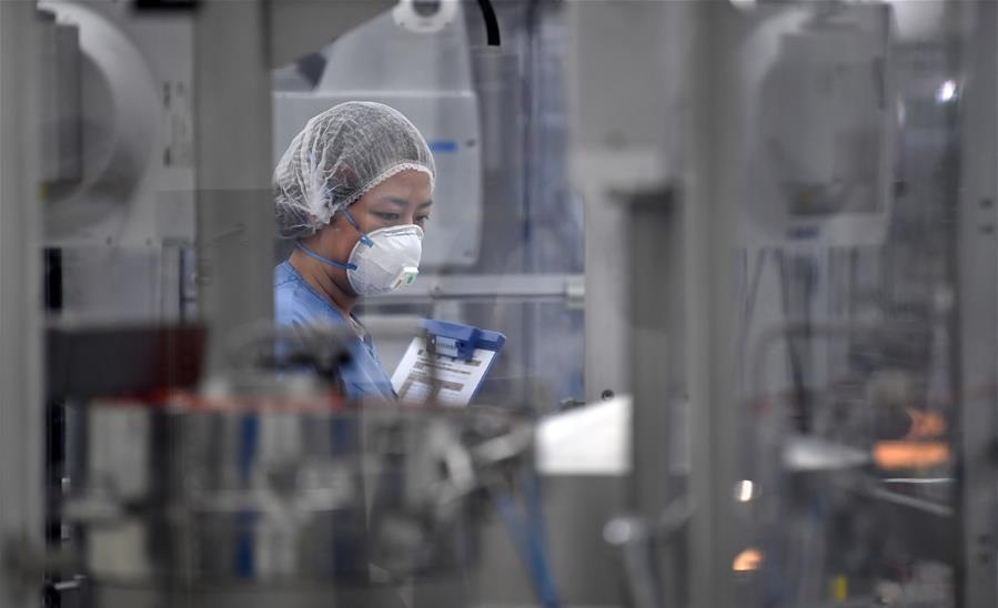 A woman works at the workshop of in Novo Nordisk China Pharmaceutical Co. Ltd. in Tianjin