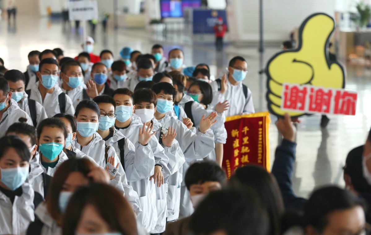Medics from Yunnan province prepare to fly back home from Wuhan Tianhe International Airport after completing their mission in Wuhan