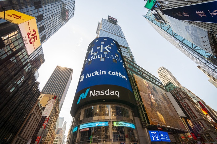 The giant video screen on the Nasdaq stock exchange in New Yorks Times Square is decorated for the Luckin Coffee initial public offering on Friday May 17 2019