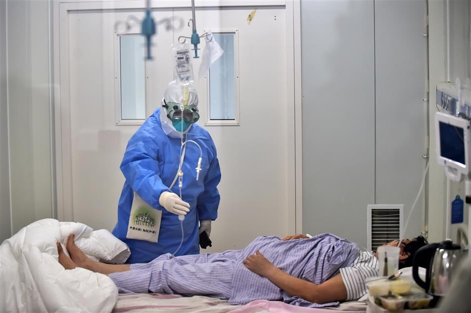 A COVID 19 patient is treated at Beijing Ditan Hospital on June 16 2020